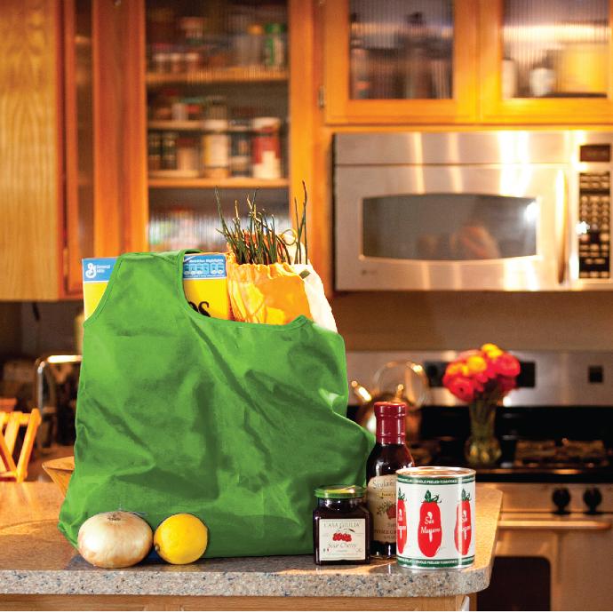 Pale Green Vita Polyester Shoulder Tote filled with groceries on a kitchen counter