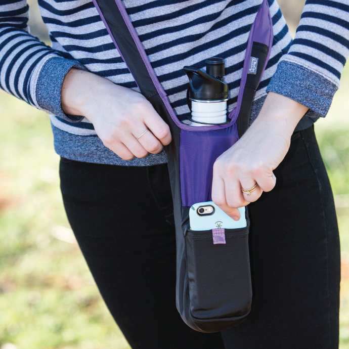 A person with a Amethyst ChicoBag Bottle Sling rePETe across someones body with a white reusable water bottle in it