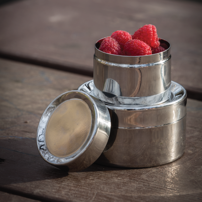 two To-Go Ware Stainless Steel Sidekicks stacked on top of one another. The Small Sidekick has rasberries in it